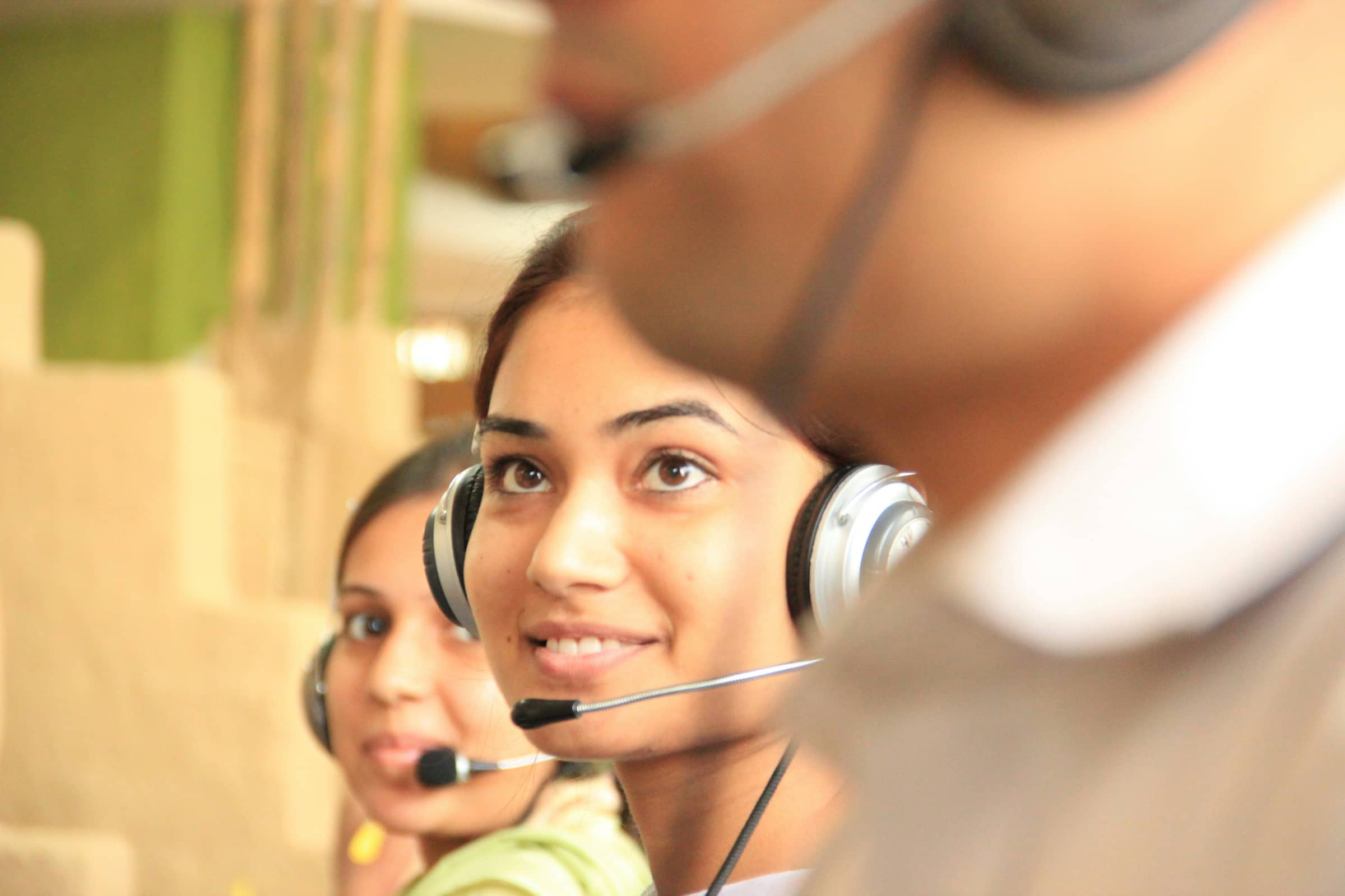 Support team talking to customers with headsets