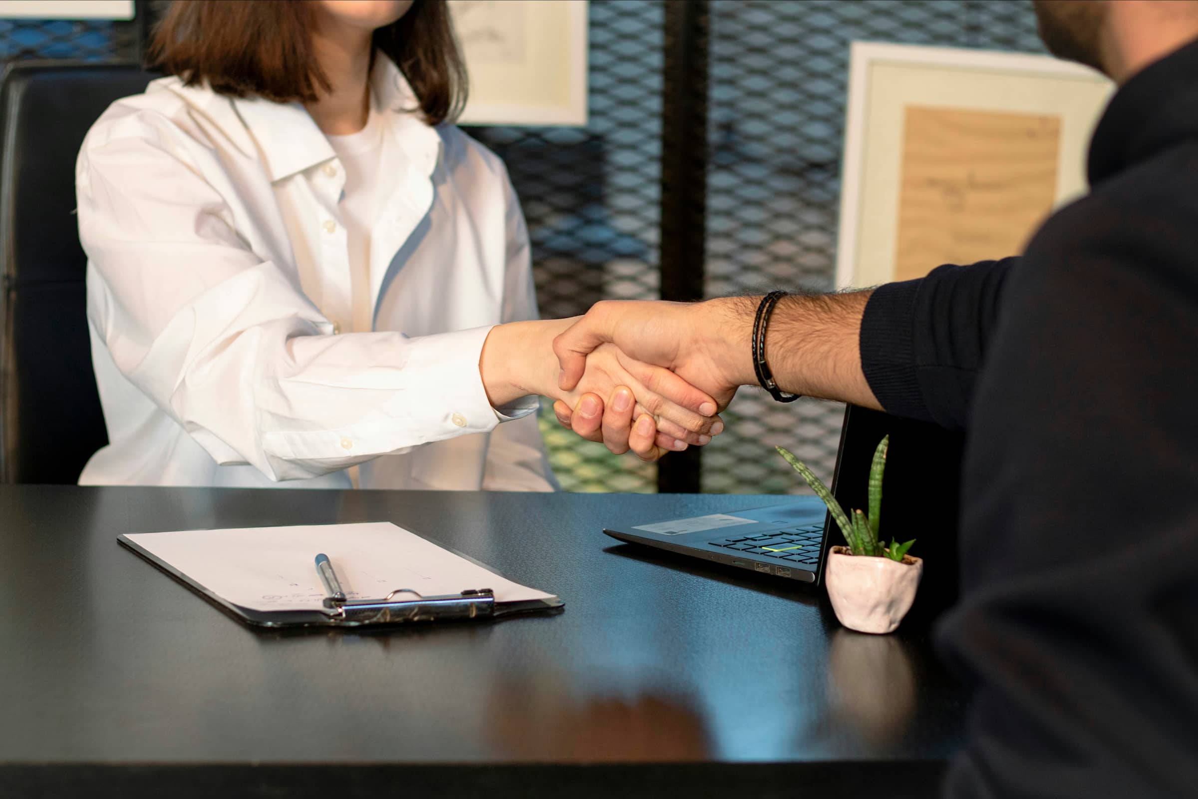 Two business people shaking hands after a meeting