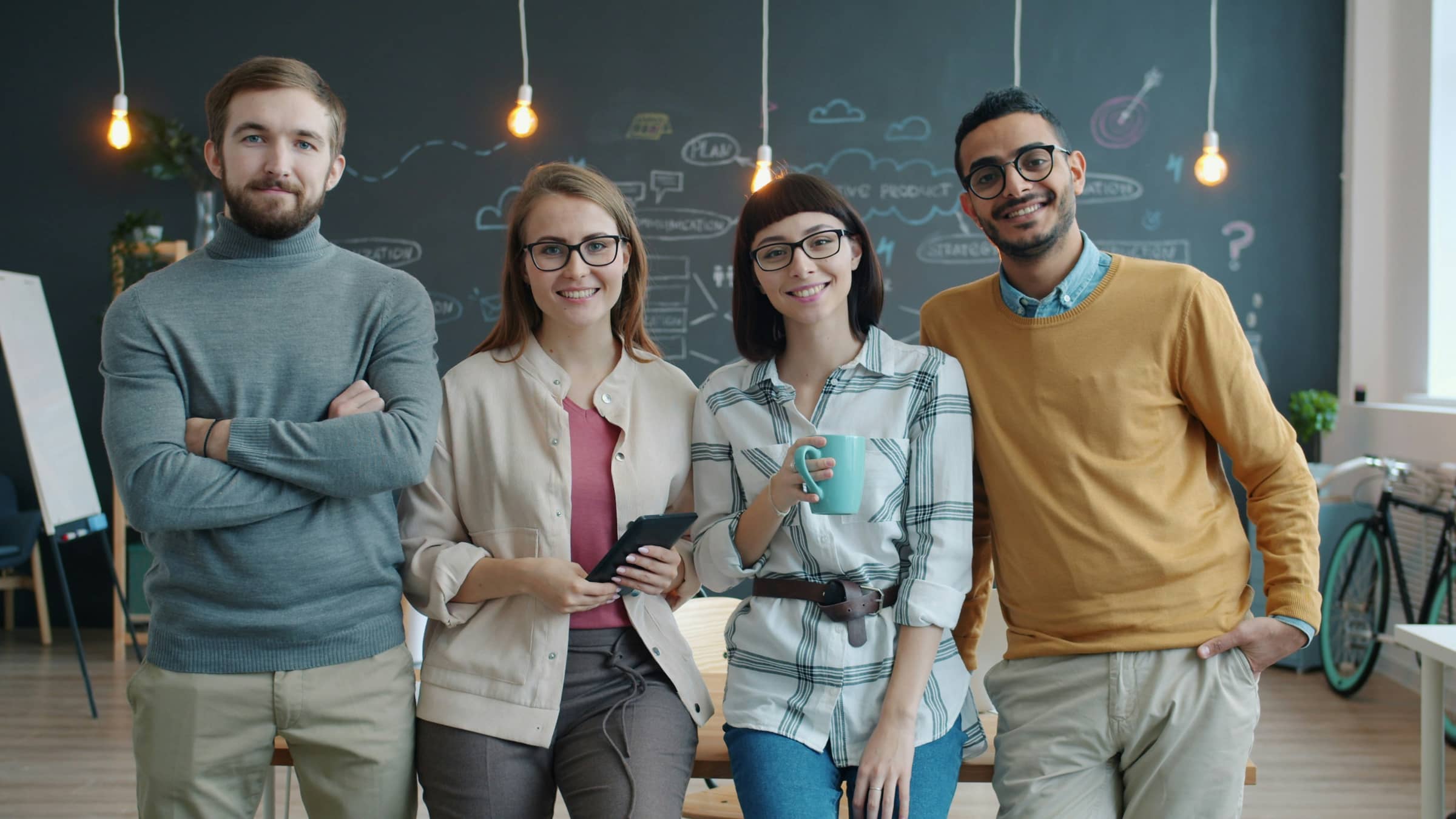 Software team standing together in the office